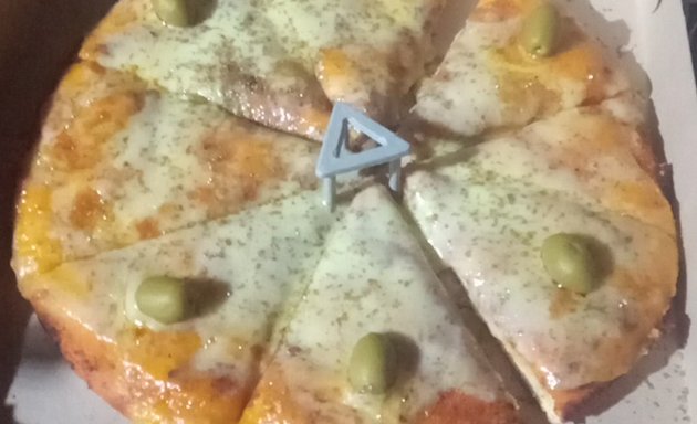 Foto de Pizzería al paso