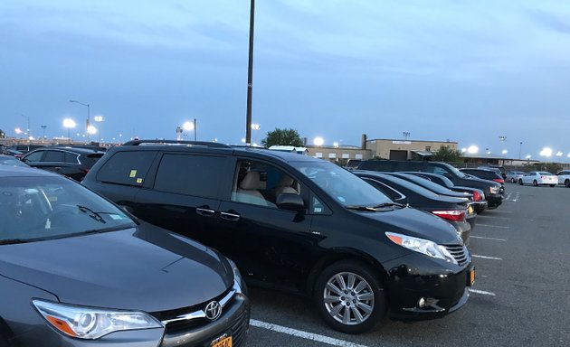 Photo of Black Car UBER LOT