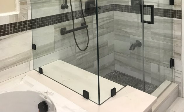 Photo of Glass shower door & mirror