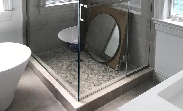 Photo of Frameless shower doors enclosure, sliding doors