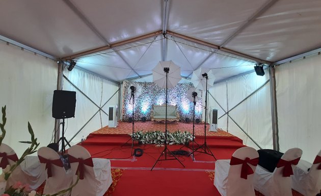 Photo of D T tent house lighting and sound system