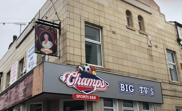Photo of Champs Sports Bar • Topping Street