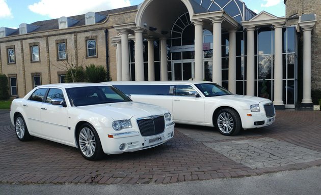 Photo of Men In White Limos